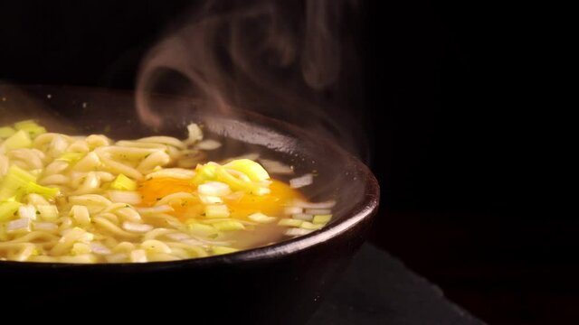 Bowl with classical chinese hot noodle soup.