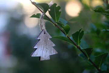 Christmas tree decoration hanging in the garden. Selective focus.