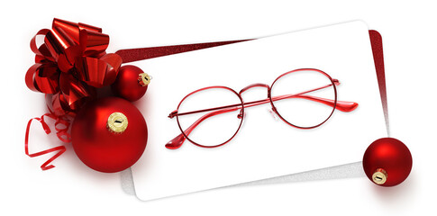 eyeglasses gift card, red spectacles and red christmas balls with ribbon bow, isolated on white 
background