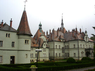 Obraz premium Old castle building with wet red tiled roof and Shenborn Palace towers