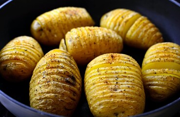 Baked crispy hasselback potatoes.