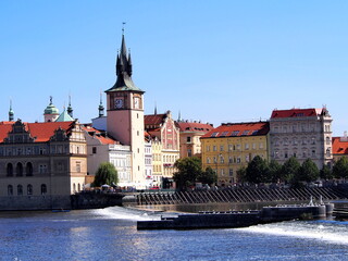 Fototapeta premium view of Prague from the deck of a steamer, historical city center, panorama on the Vltava, sunny summer day, tourism