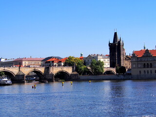 view of Prague from the deck of a steamer, historical city center, panorama on the Vltava, sunny summer day, tourism