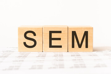 Word sem. Wooden small cubes with letters isolated on white background with copy space available.Business Concept image.