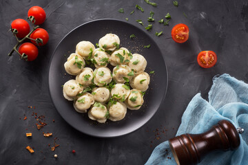 Fragrant meat dumpling with tomatoes on the table.