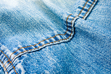 clothing items blue stonewashed faded jeans cotton fabric texture with seams, clasps, buttons and...