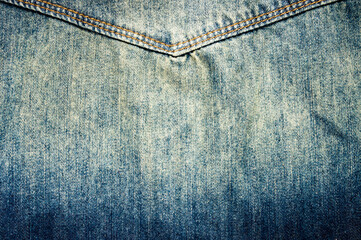 clothing items blue stonewashed faded jeans cotton fabric texture with seams, clasps, buttons and...