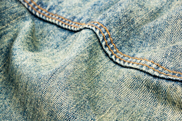 clothing items blue stonewashed faded jeans cotton fabric texture with seams, clasps, buttons and...