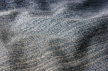 clothing items blue stonewashed faded jeans cotton fabric texture with seams, clasps, buttons and...