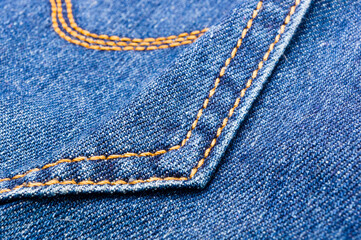 clothing items blue stonewashed faded jeans cotton fabric texture with seams, clasps, buttons and...