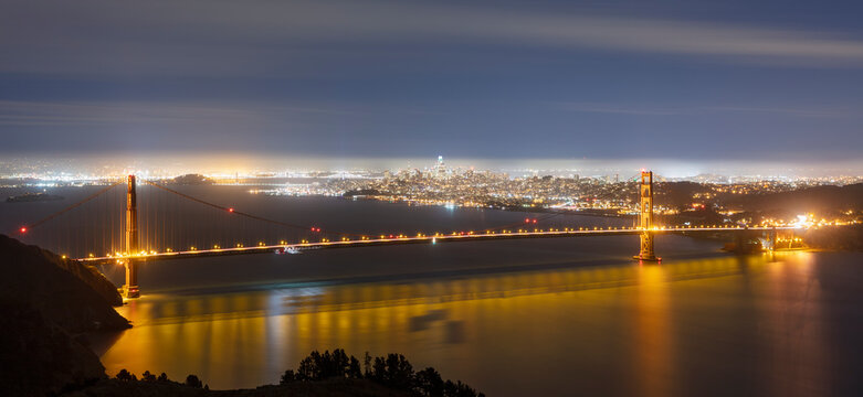 Glowing Golden Gate Bridge at night in San Francisco, California, USA