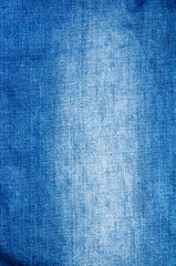clothing items blue stonewashed faded jeans cotton fabric texture with seams, clasps, buttons and rivets, macro, close-up