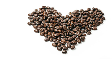 Coffee beans. Isolated on a white background.  Heart shaped from premium coffee beans, isolated on white, close up