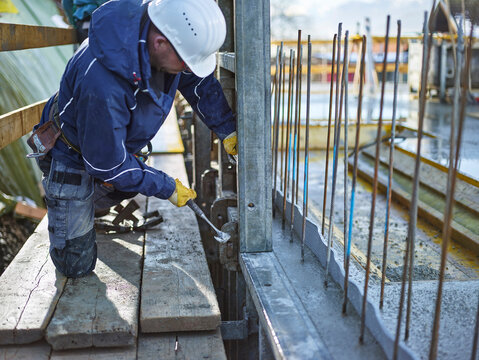 Construction worker working on plywood