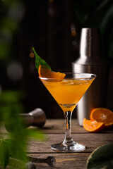 Orange martini cocktail in rustic style