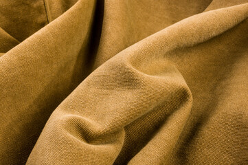 clothing items stonewashed cotton fabric texture with seams, clasps, buttons and rivets, macro