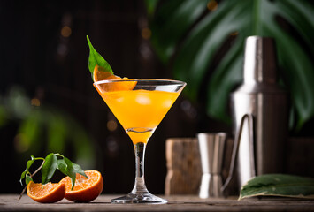 Orange martini cocktail in rustic style