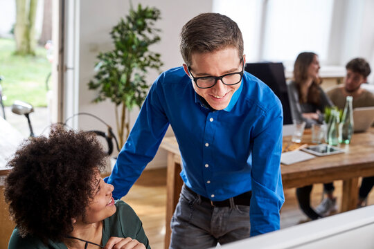 Smiling coworkers in office