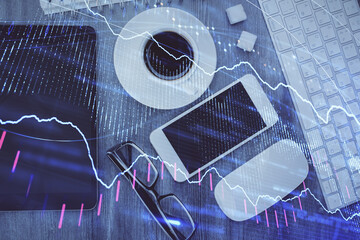 Multi exposure of forex graph hologram over desktop with phone. Top view. Mobile trade platform concept.