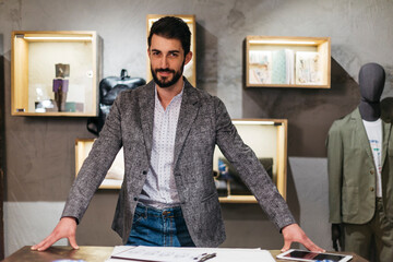 Portrait of confident man in menswear shop