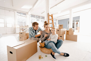 Happy family moving into new home