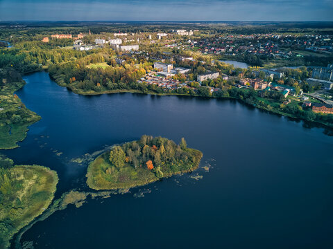 Aerial view of Bethany Pond by city on sunny day