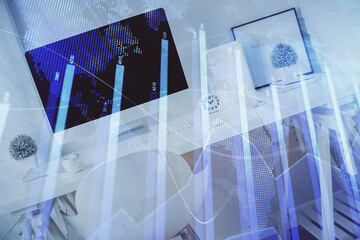 Double exposure of financial graph drawing and office interior background. Concept of stock market.