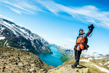 hiker in the mountains taking selfie