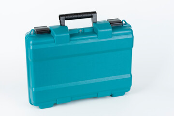Green carry case for cordless hammer screwdriver drill on white background. Studio shoot.