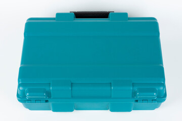 Green carry case for cordless hammer screwdriver drill on white background. Studio shoot.