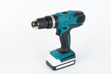 Green cordless hammer screwdriver drill on white background. The tool can be used as a drill hammer or a screwdriver or flat drill The drill has two speed an keyless chuck.
