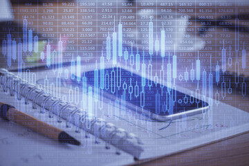 Double exposure of forex chart drawing and cell phone background. Concept of financial data analysis