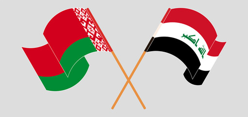 Crossed and waving flags of Iraq and Belarus