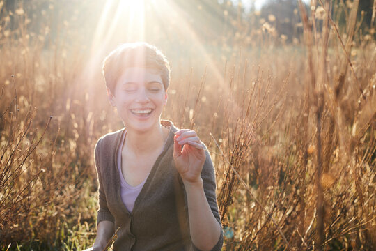 Portrait Of Laughing Woman Relaxing In Nature