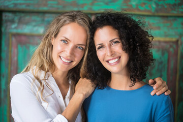 Portrait of two smiling women side by side