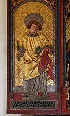 Fototapeta na wymiar Santo Stefano; portella di altare scolpito nella chiesa di San Mauro presso Baselga di Pinè