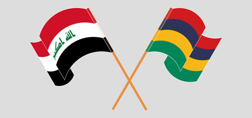 Crossed and waving flags of Iraq and Mauritius