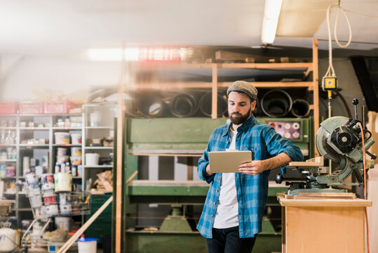 Man using tablet in workshop