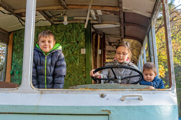 Childrens play in an abandoned bus.