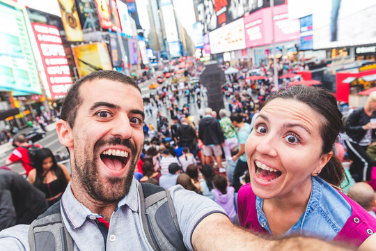 USA, New York, selfie of happy couple in the city at Times Square