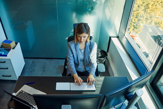 Businesswoman using computer in office