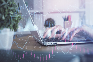 Double exposure of woman hands typing on computer and forex chart hologram drawing. Stock market invest concept.