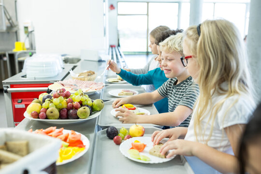 Pupils At Counter In School Canteen