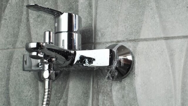 plumber Fixing a leaking tap Faucet by Adjustable wrench , DIY job housework  fix leak repair