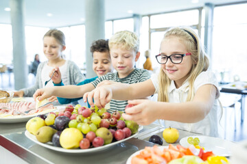 Pupils at counter in school canteen
