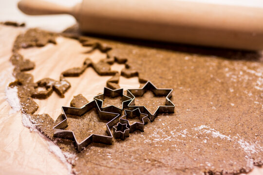 Low angle view of cookie cutter and rolling pin