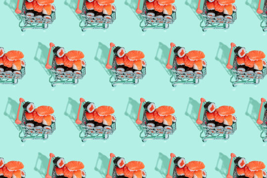 Fresh Japanese food in shopping carts on mint green background