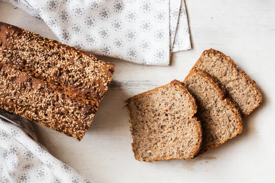 Buckwheat bread loaf with sliced bread kept on table