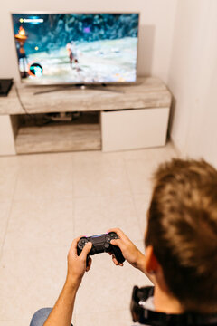 Man enjoying at home while playing video games