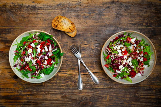 Two bowls of vegetable salad with lentils, arugula, red bell pepper, feta cheese and&Ocirc;&oslash;&Omega;radicchio
